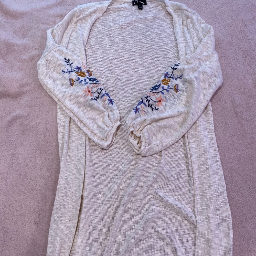 Size medium mid calf length cardigan with sleeve design.